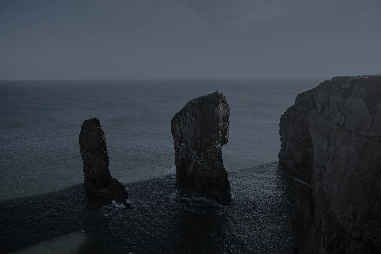 Sea stacks standing off a cliff coastline
